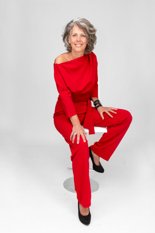 Asymmetrische jumpsuit met vleermuismouwen en ceintuur